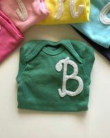 Monogram eerste onesie